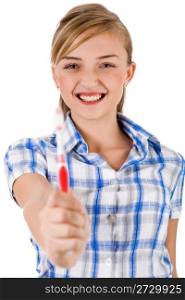Young women showing the toothbrush on a white background