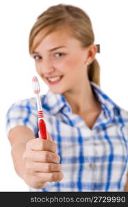 Young women showing the toothbrush on a white background