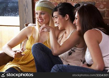 Young women sitting together and talking