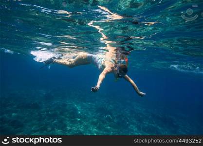 Young Women Snorkeling in the Tropical Water of Indian Ocean.