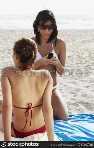 Young women sunbathing on beach
