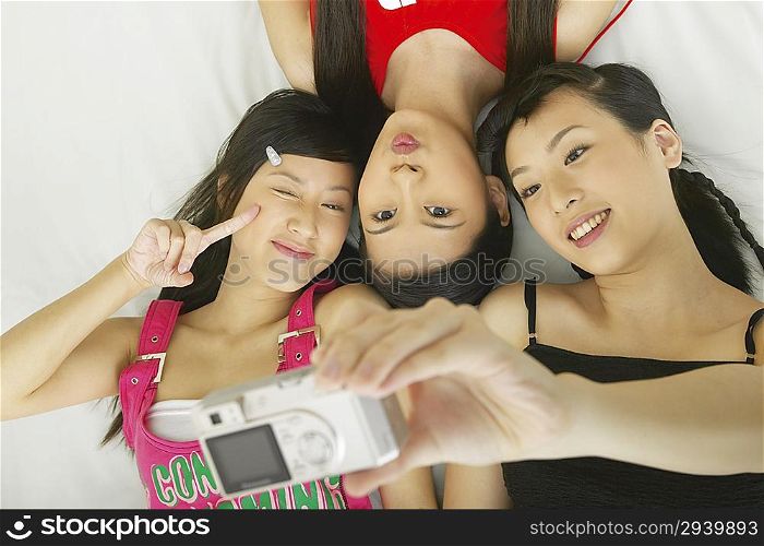 Young women taking photo of themselves