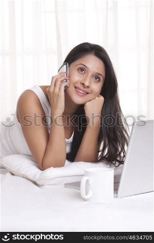Young WOMEN talking on mobile phone