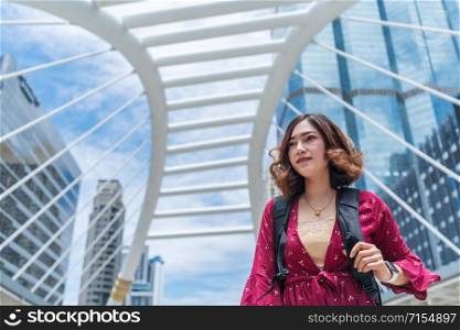 young women travel at Chong Nonsi skytrain in Bangkok, Thailand