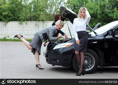 young women with broken car