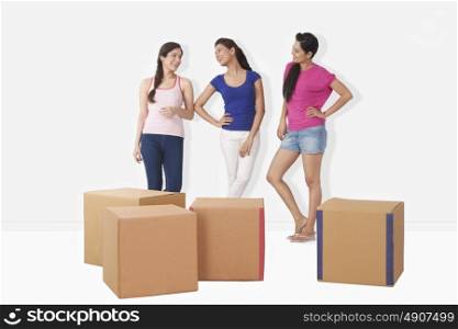 Young women with cartons
