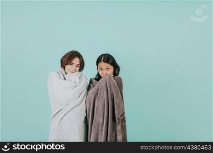 young women wrapping blankets