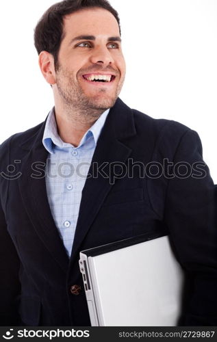 Young worker carrying a laptop with a broad smile on a white background