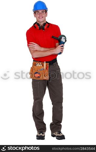 Young worker holding angle grinder