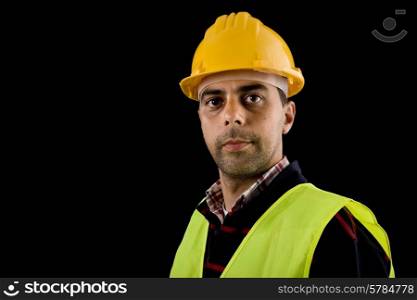 young worker portrait in a black background