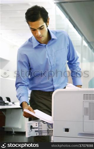 young worker using a copy machine