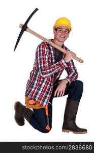 Young worker with a pickaxe