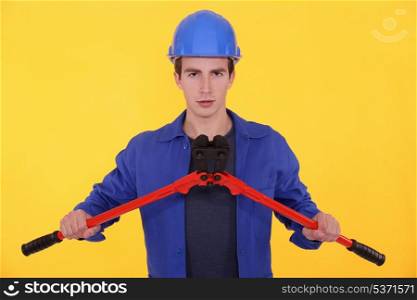 Young worker with bolt cutters