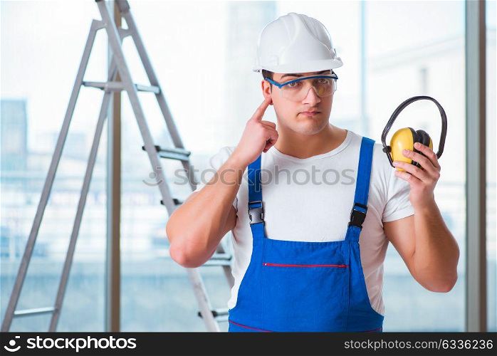 Young worker with noise cancelling headphones