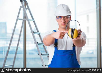 Young worker with noise cancelling headphones