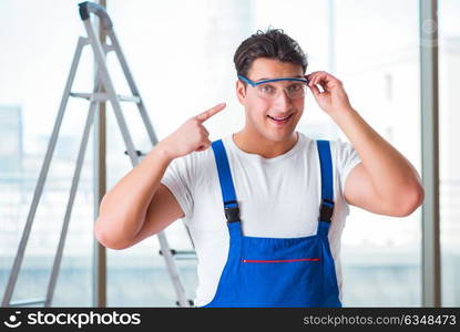 Young worker with safety goggles