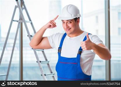 Young worker with safety helmet hardhat