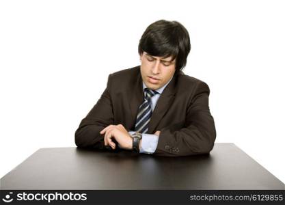 young worried businessman on a desk, isolated on white