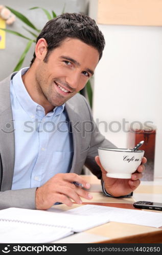 Young writing during breakfast