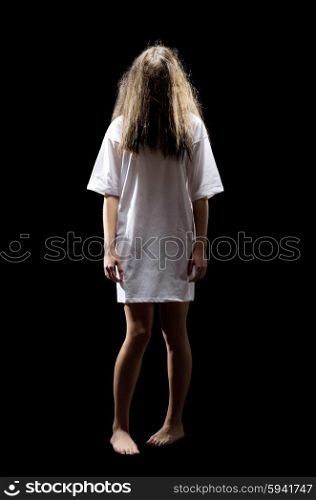 Young zombie girl isolated on black