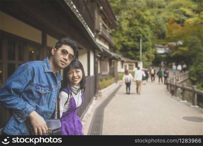 younger asian man and woman traveling with happiness in japan destination