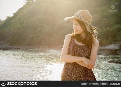 younger asian woman on vacation beach