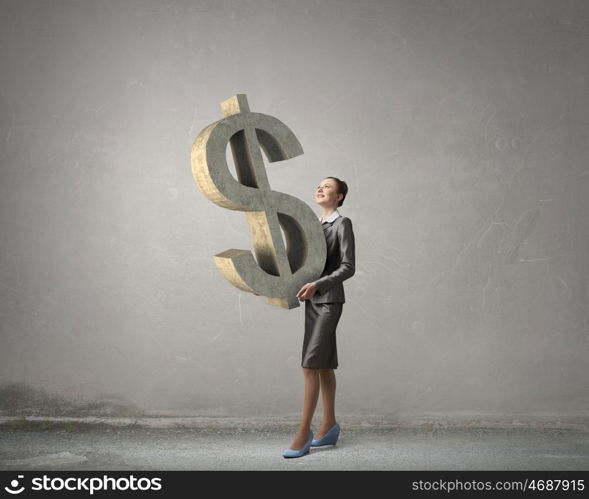 Your big interest rate. Young businesswoman holding big dollar symbol in hands
