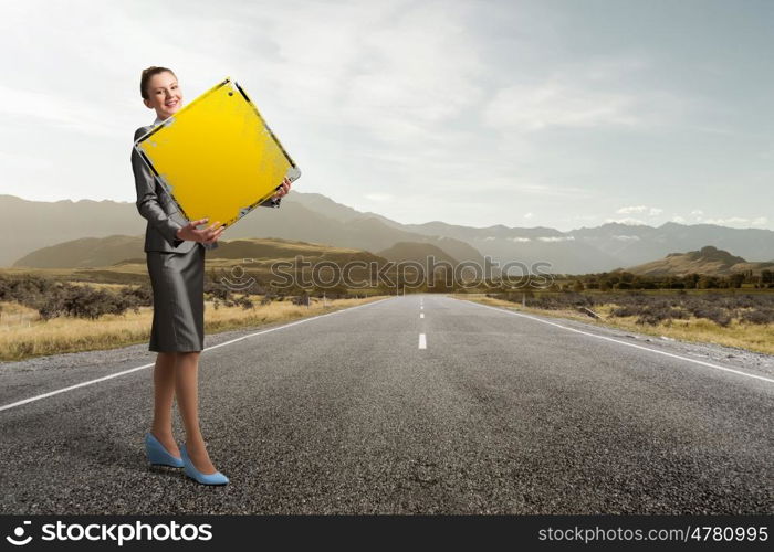 Your big interest rate. Young businesswoman holding sign with big dollar symbol in hands