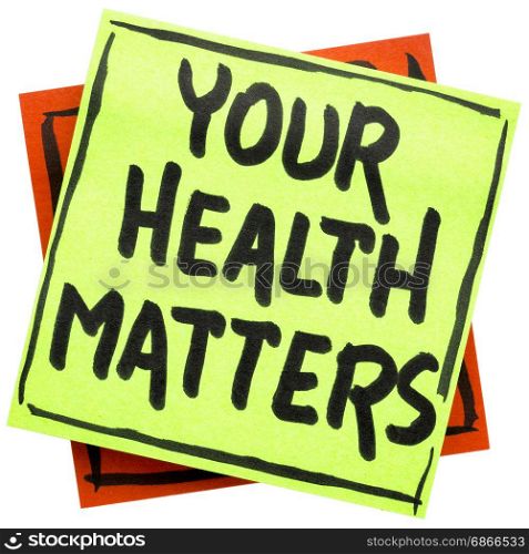 your health matters reminder - handwriting in black ink on an isolated sticky note