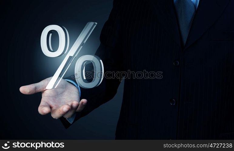 Your interest rate. Close view of businessman holding in palm percent sign