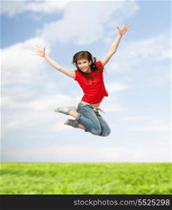 youth and fitness concept - happy girl jumping in the air