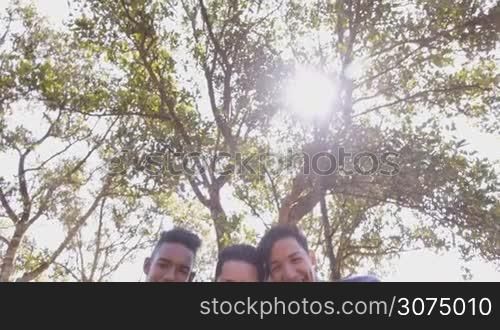 Youth culture, young people, group of male friends, multi-ethnic teens outdoors, teenagers together in park. Portrait of happy boys smiling, kids looking at camera. Slow motion