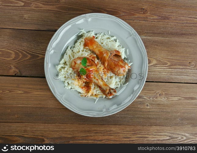 Youvetsi. Braised Chicken with pasta Tomato Based Sauce. baked Greek meat dish