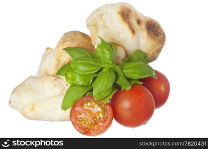 yucca bread, tomatoes and basil on white background