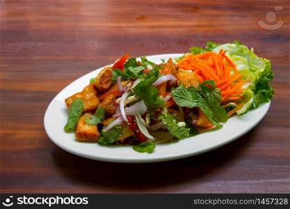 yum spicy The belly meat of salmon salad in Thai Style cuisine