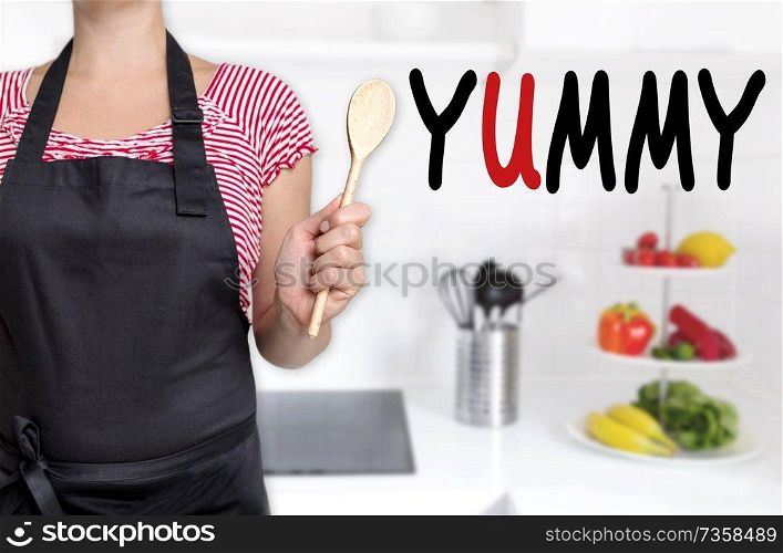 yummy chef holding wooden spoon background.. yummy chef holding wooden spoon background