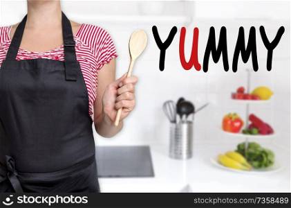 yummy chef holding wooden spoon background.. yummy chef holding wooden spoon background