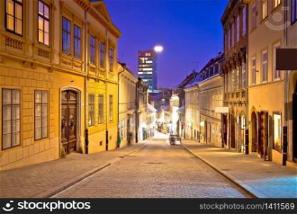 Zagreb. Radiceva old cobbled street and Zagreb cityscape advent evening view, capital of Croatia