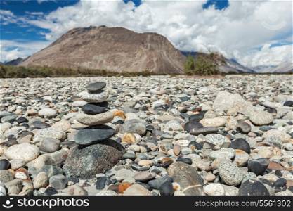 Zen balanced stones stack in Himalayas mountains. Nubra valley, Ladakh, Jammu and Kashmir, India