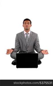 Zen businessman with a laptop