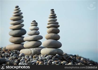 zen stones against sky