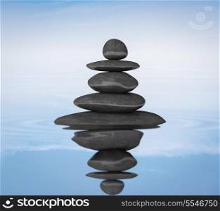 Zen stones in water with reflection balance concept