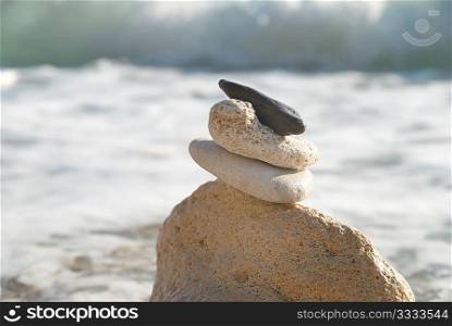 Zen stones with blue sky and sea background