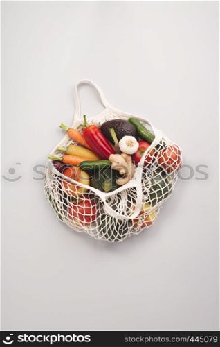 Zero waste concept. Fresh organic fruits and vegetables in mesh textile bag
