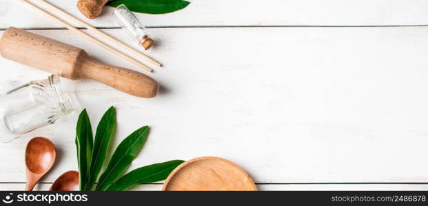 Zero waste concept. Natural biodegradable kitchen utensils on a white wooden background. Banner format. Zero waste concept. Natural biodegradable kitchen utensils on a white wooden background.