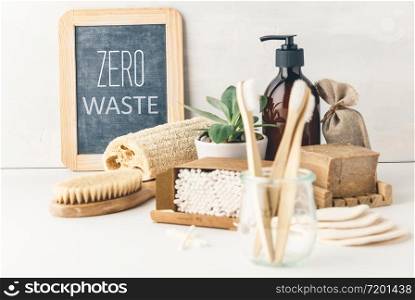 Zero waste, Recycling, Sustainable lifestyle concept. Eco-friendly bathroom accessories: toothbrushes, reusable cotton make up removal pads, make up remover in a glass container, natural brushes, handmade soap, bamboo ear sticks. Zero waste concept. Eco-friendly bathroom accessories. Sustainable lifestyle
