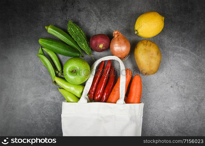 Zero waste use less plastic concept / Fresh vegetables and fruit organic in eco cotton fabric bags on table tote canvas cloth bag from market free plastic shopping