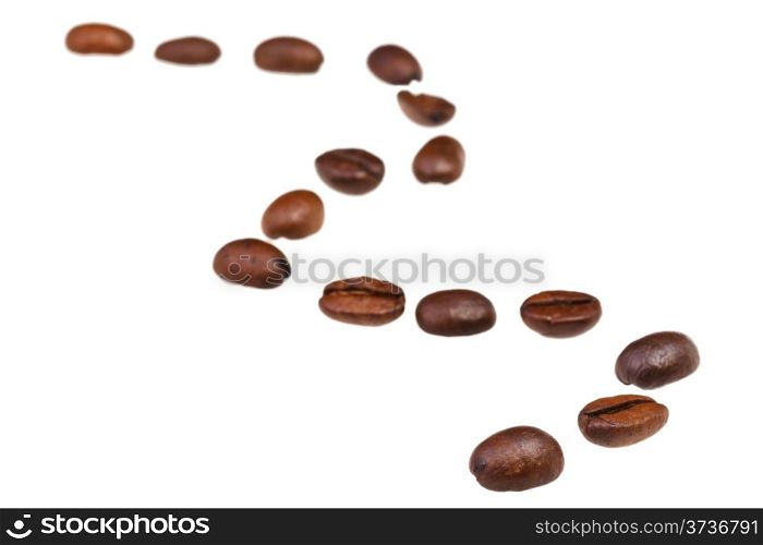 zigzag line from many roasted coffee beans with focus foreground
