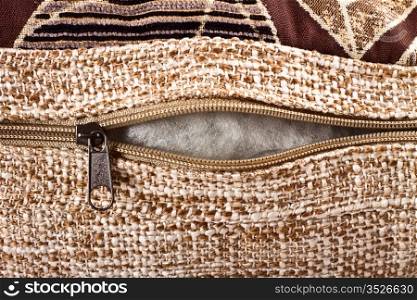 zipper clasp on decorative pillow closeup