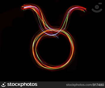 Zodiac sign from led light on black background.